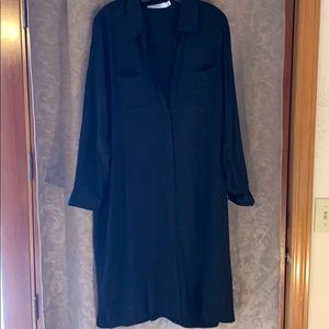 Long sleeved, button down dress.